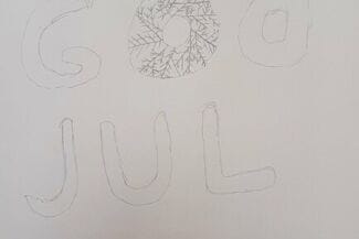 En teckning med texten god jul